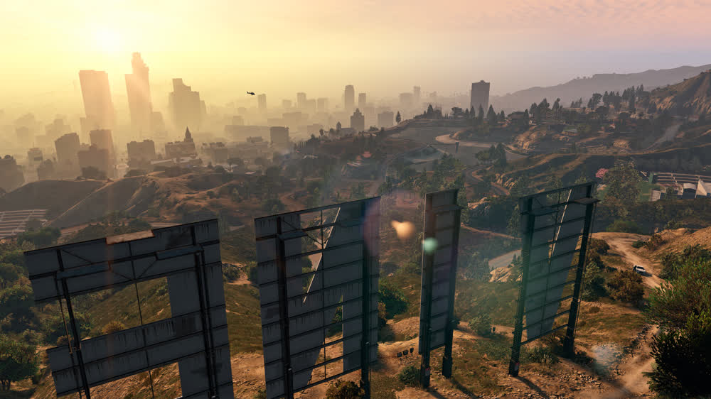 Franklin, Michael and Trevor over the Los Santos map — official Grand Theft Auto V artwork