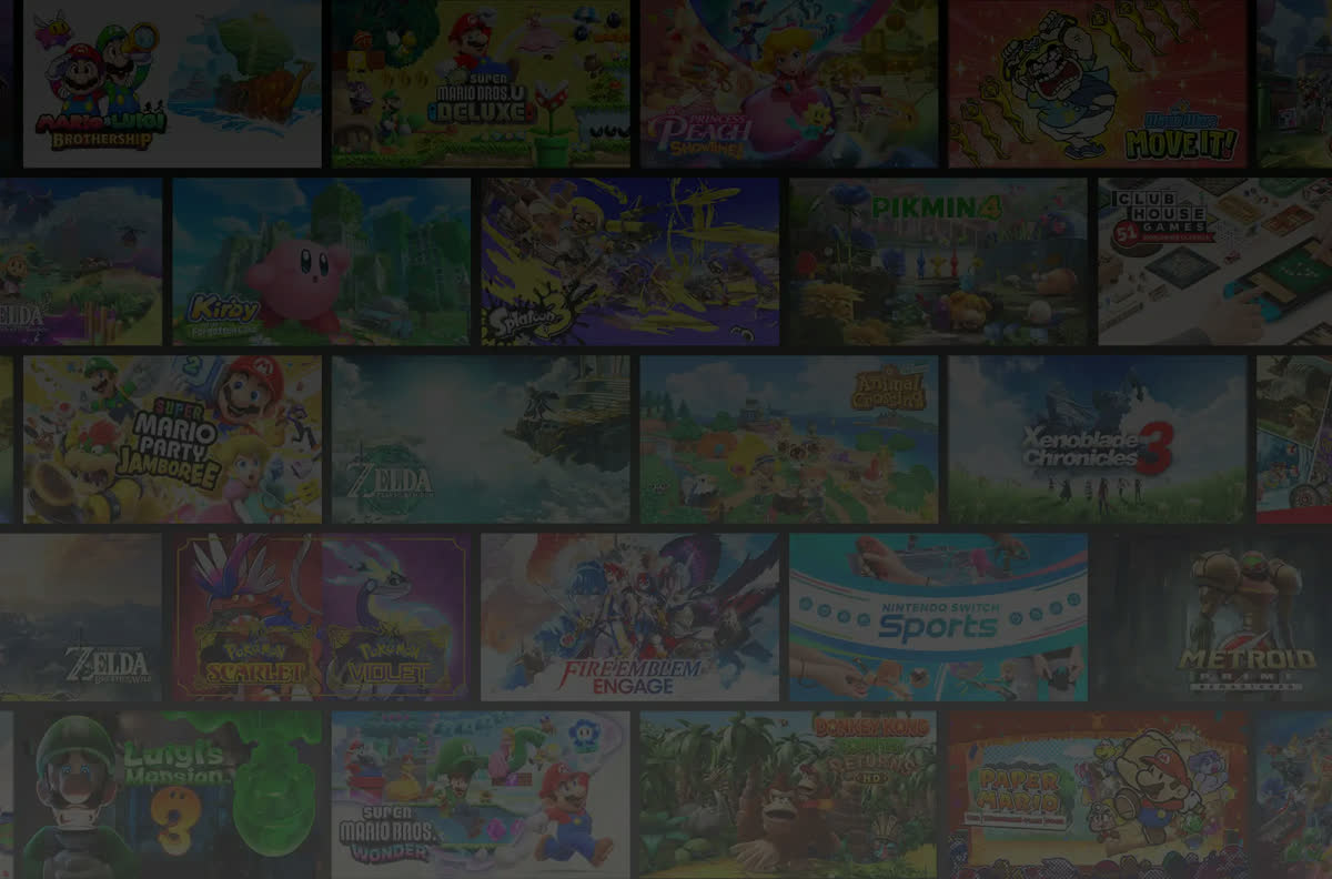 Oficjalne zdjęcie Nintendo — konsola Nintendo Switch 2 na podstawce na biurku, obok dłonie trzymające kontroler Joy-Con 2