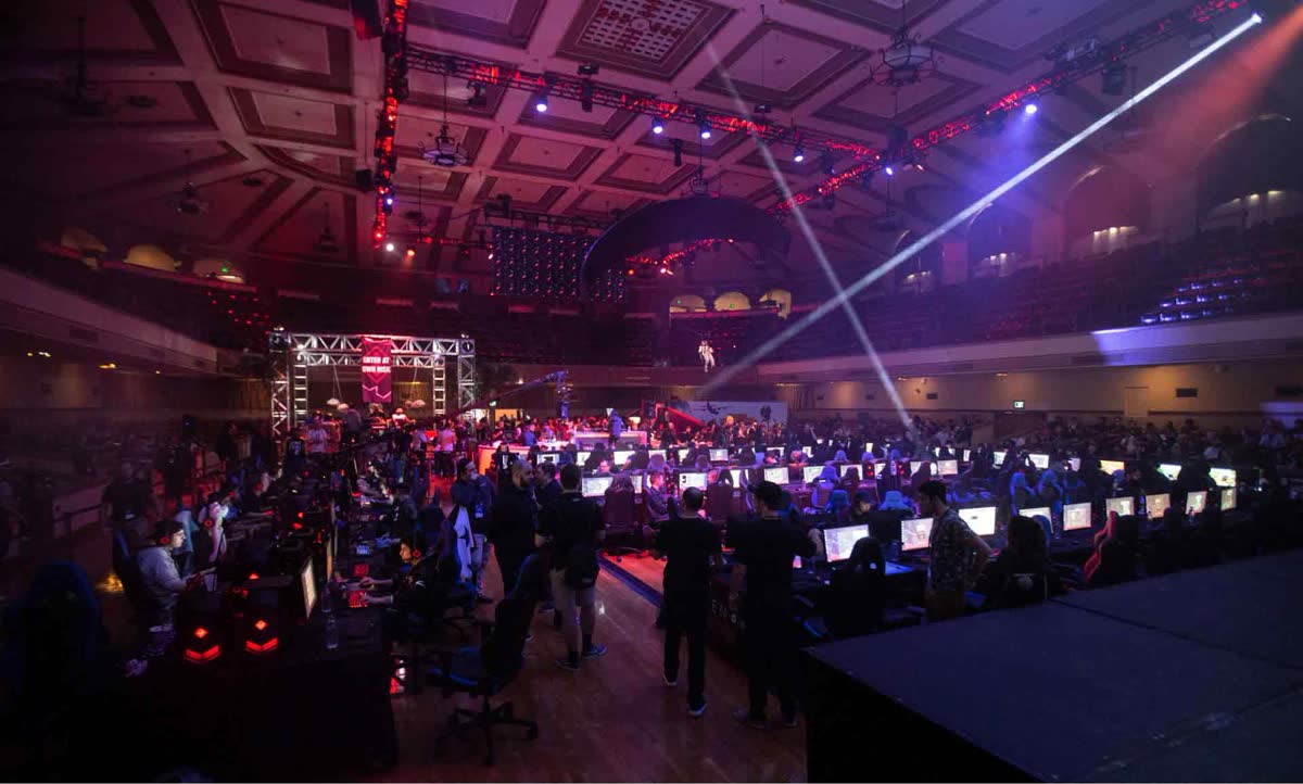 TwitchCon crowd lit purple, watching the stage — official Twitch photography